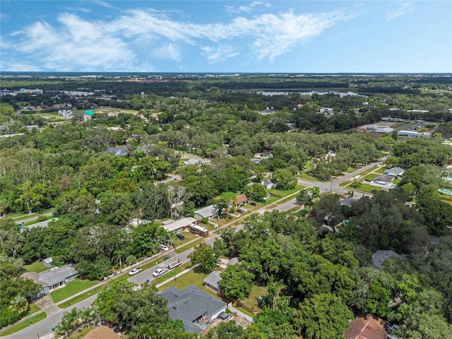 aerial view featuring a wooded view