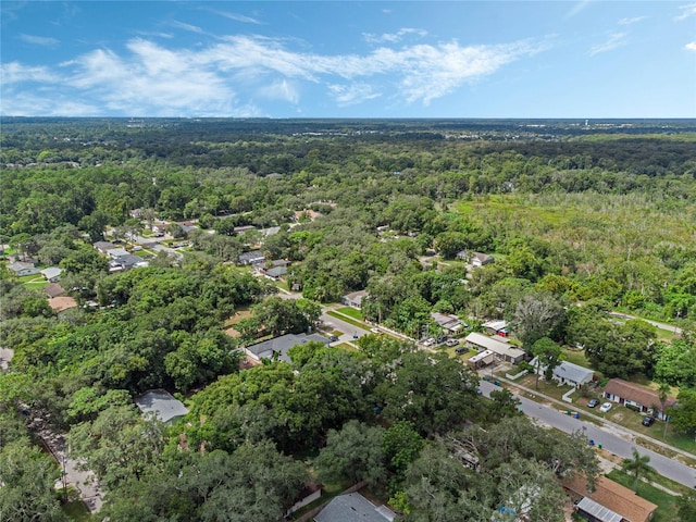 drone / aerial view featuring a view of trees