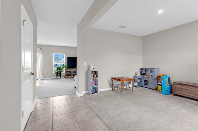 playroom featuring light colored carpet