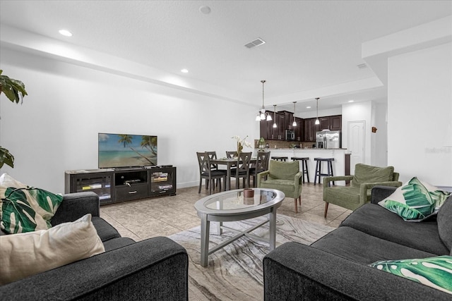 living room with light tile patterned floors