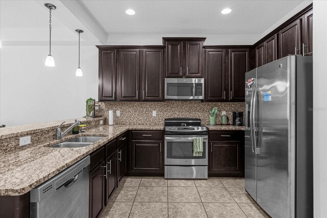 8110 Roseville Rd, Davenport, FL 33896 - kitchen with a sink, tasteful backsplash, appliances with stainless steel finishes, and a peninsula