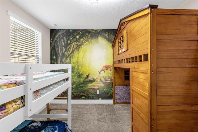 carpeted bedroom with a textured ceiling