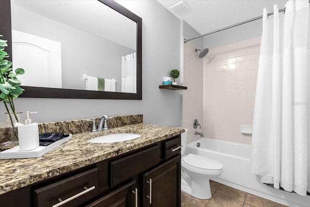 full bathroom with vanity, tile patterned flooring, shower / tub combo, a textured ceiling, and toilet