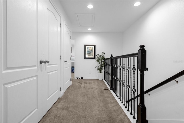 8110 Roseville Rd, Davenport, FL 33896 - hallway featuring recessed lighting, baseboards, carpet floors, and an upstairs landing