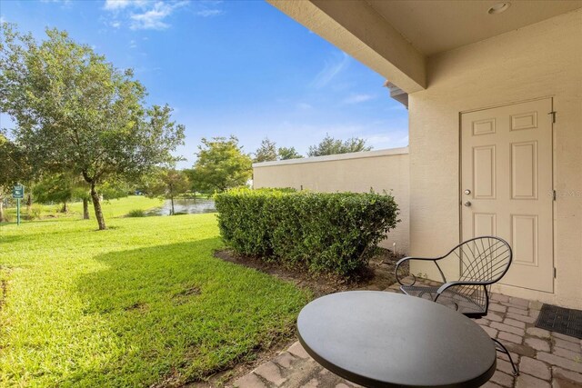 8110 Roseville Rd, Davenport, FL 33896 - view of yard featuring a patio area and a water view