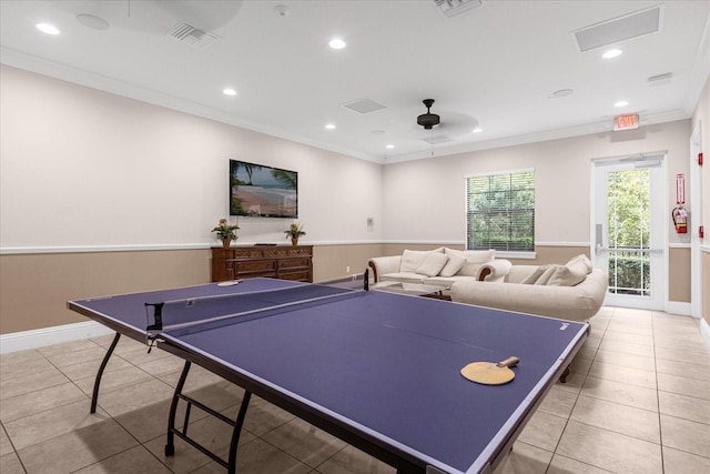 recreation room featuring ceiling fan, light tile patterned flooring, and ornamental molding