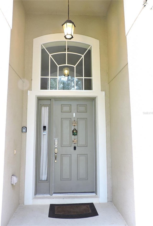 doorway to property with stucco siding