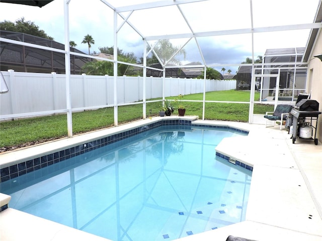 view of pool featuring a fenced in pool, a lanai, a fenced backyard, and a lawn