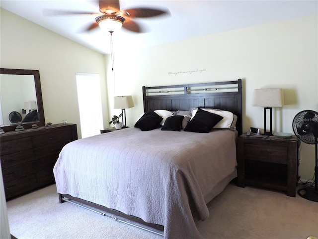 bedroom with a ceiling fan and light colored carpet