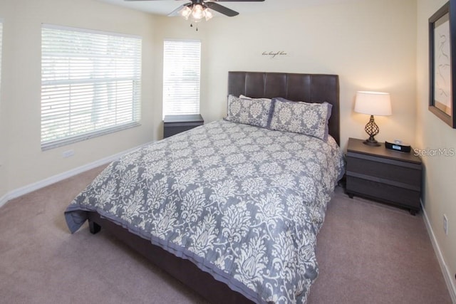 bedroom featuring a ceiling fan, carpet flooring, and baseboards