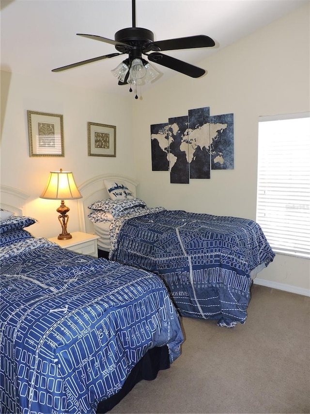 bedroom with carpet, ceiling fan, and baseboards