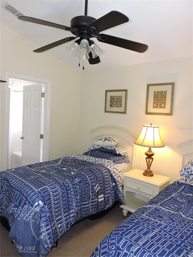 carpeted bedroom with visible vents and a ceiling fan