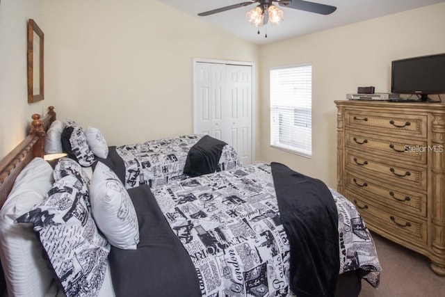 bedroom featuring carpet, a ceiling fan, vaulted ceiling, and a closet