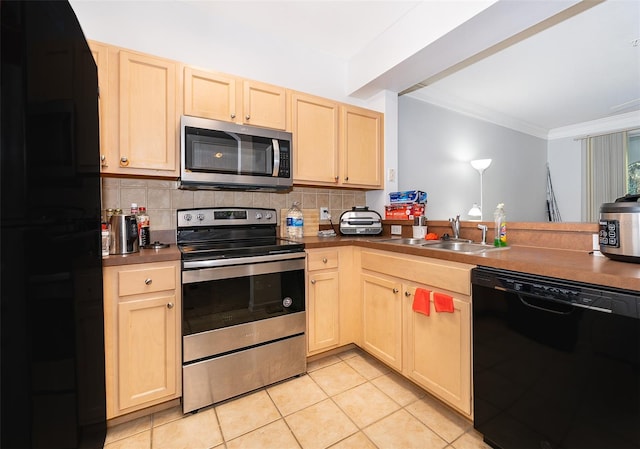 kitchen with sink, tasteful backsplash, light tile patterned flooring, black appliances, and ornamental molding