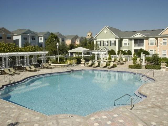 view of swimming pool with a pergola and a patio