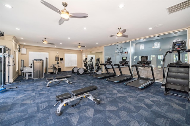 exercise room featuring ornamental molding