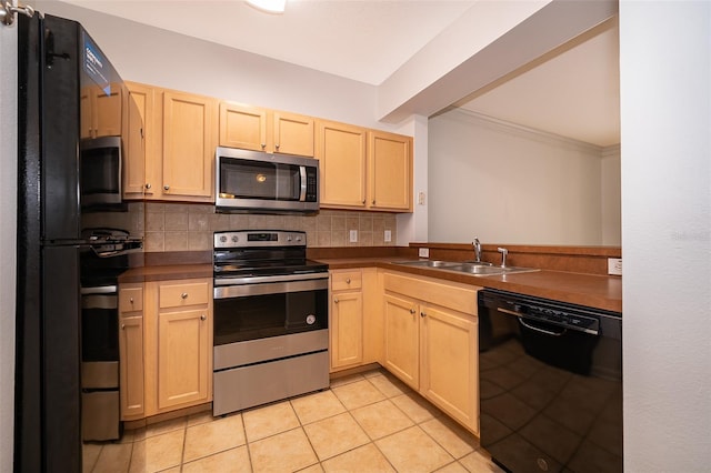 kitchen featuring tasteful backsplash, sink, black appliances, and light brown cabinetry