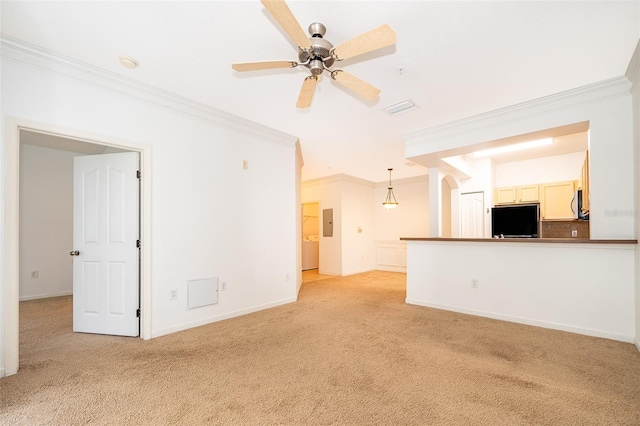 unfurnished living room with crown molding, light colored carpet, and ceiling fan