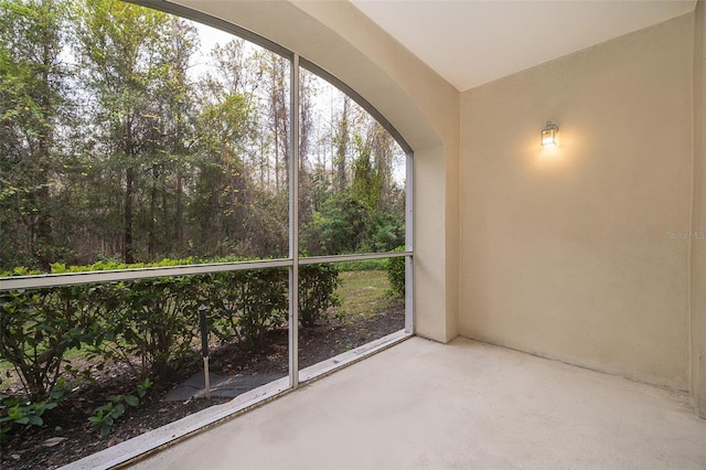 unfurnished sunroom featuring a wealth of natural light