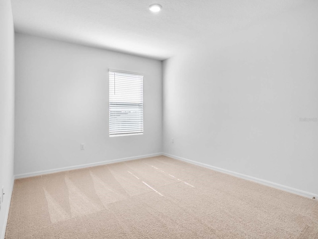 spare room featuring carpet flooring