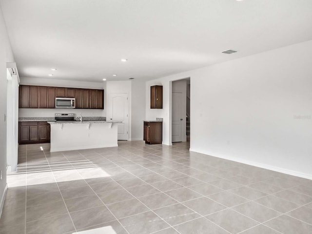 interior space with sink and light tile patterned flooring