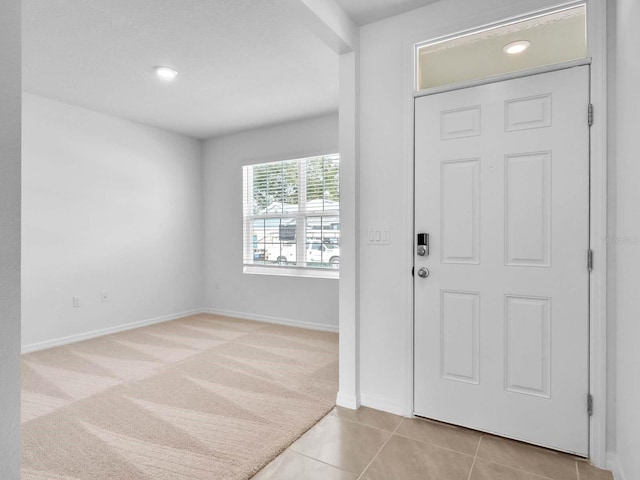 entryway with light carpet