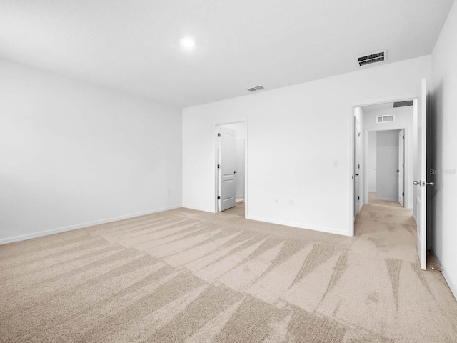 unfurnished bedroom featuring light colored carpet