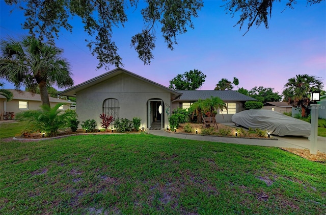 ranch-style house featuring a yard