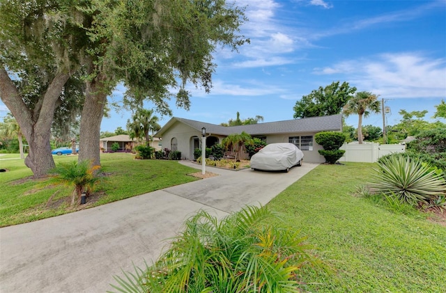 single story home featuring a front yard