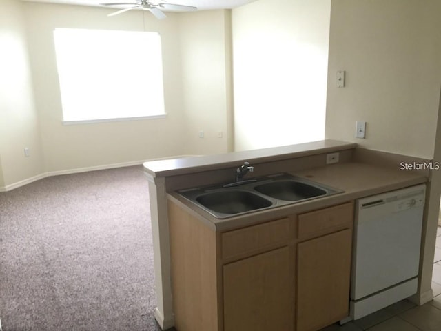 kitchen featuring ceiling fan, sink, light carpet, and dishwasher