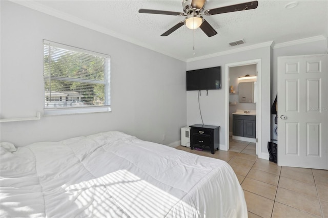 bedroom with ceiling fan, ensuite bath, sink, crown molding, and light tile patterned flooring