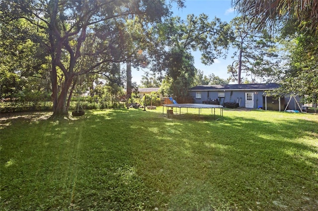 view of yard featuring a trampoline