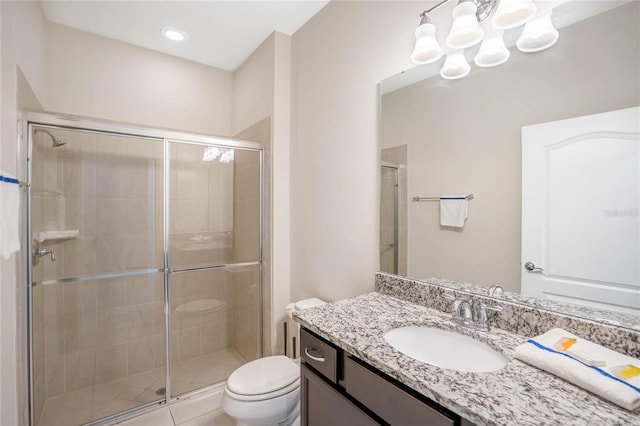 full bathroom featuring toilet, a shower stall, and vanity