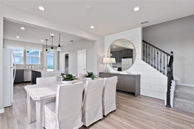 dining space featuring light hardwood / wood-style flooring