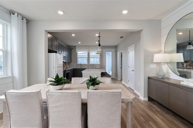 dining area featuring hardwood / wood-style floors and a wealth of natural light