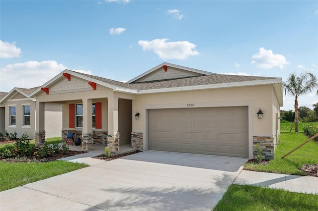 view of front of property with a garage and a front lawn