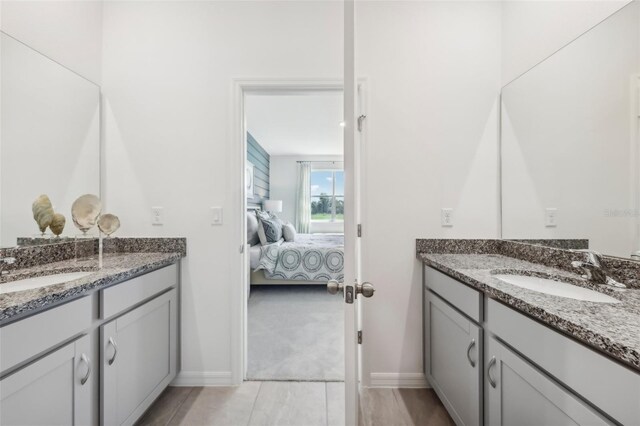 bathroom with vanity and tile patterned floors