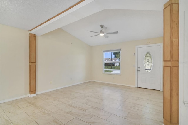 entryway featuring light tile patterned flooring, vaulted ceiling, and ceiling fan