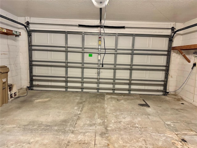 garage with concrete block wall