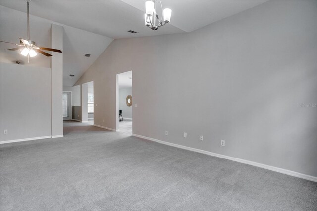 additional living space with carpet floors, high vaulted ceiling, and ceiling fan with notable chandelier