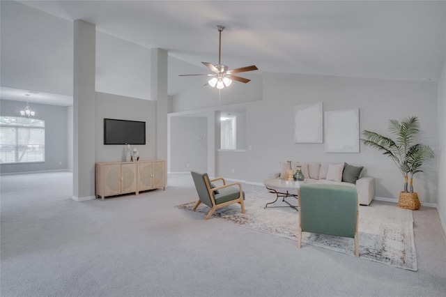 living room with carpet floors, ceiling fan with notable chandelier, and high vaulted ceiling