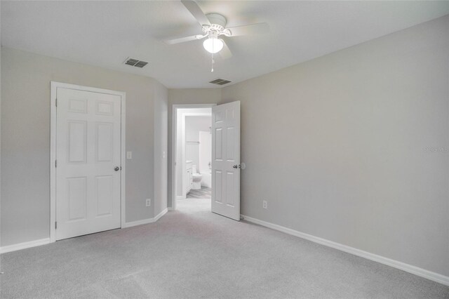 unfurnished bedroom featuring ceiling fan and carpet