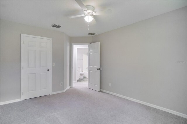 unfurnished bedroom featuring carpet and ceiling fan