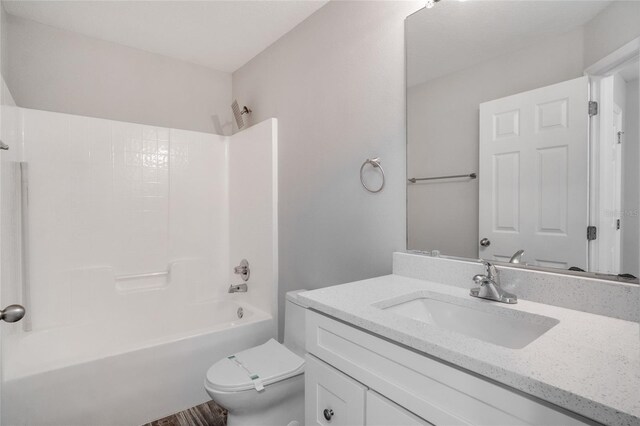 full bathroom with shower / bath combination, toilet, and vanity