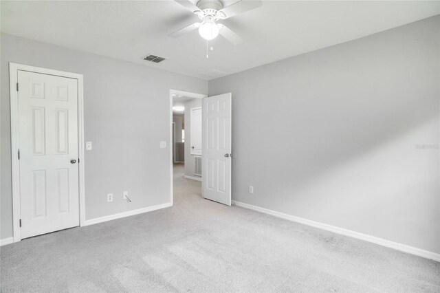 unfurnished bedroom featuring ceiling fan and carpet floors