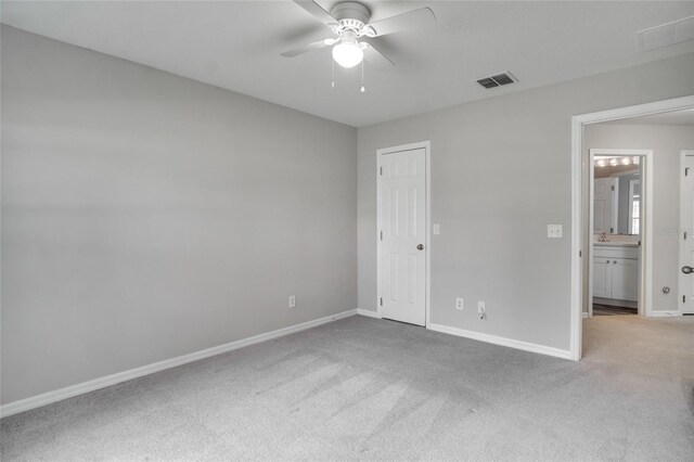 carpeted empty room with ceiling fan