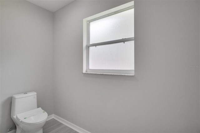 bathroom featuring toilet and hardwood / wood-style floors