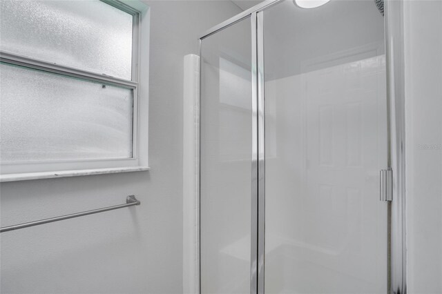 bathroom with walk in shower