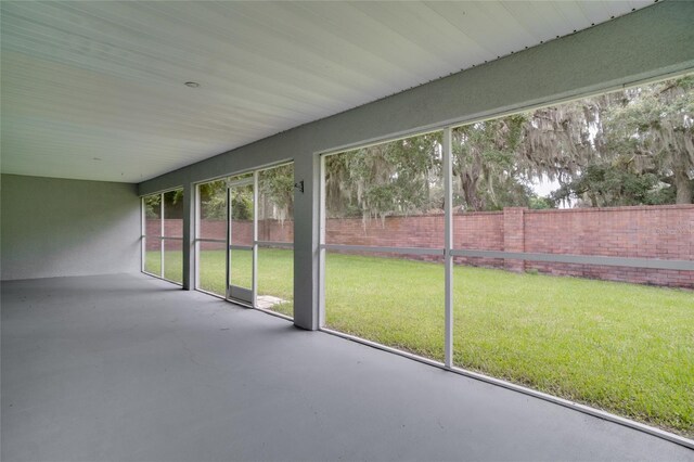 unfurnished sunroom featuring a healthy amount of sunlight