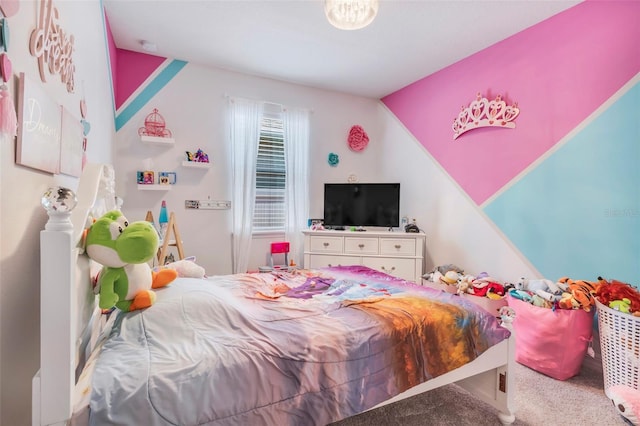 bedroom with lofted ceiling and carpet floors